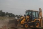 Rewari News: धारूहेड़ा में अवैध कॉलोनी पर चला बुलडोजर
